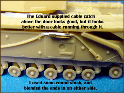 [The Eduard set also provided the cable catches above the sponson side doors.]