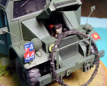 [the kit front bumper assembly was replaced by Eduard parts, with scratch built tow clevis, and winch fair leads.]