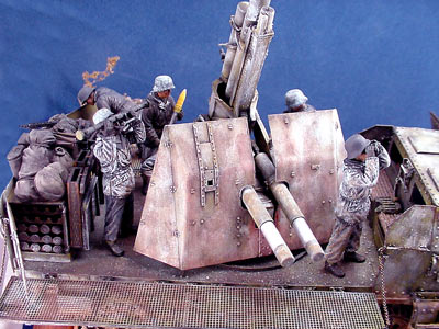 [Dragon's Flak 88 crew provided the figures that come in a set with additional arms for making the anti-aircraft figure positions.]