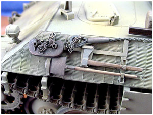 [The side-mounted tools are secured with PE tool clips and small angle shaped chain and pins are used to hold the tow cables in place.]