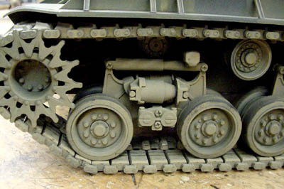 [The horizontal volute spring suspension commonly referred to as HVSS.]