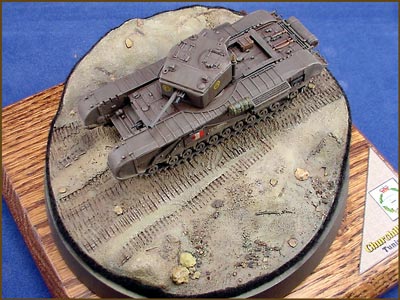 [The base was primed with Burnt Umber, and then feather layered with increasingly lighter shades of browns, tans and buffs with an airbrush .]