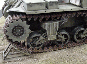 [I added detail to the kit bogie assembly by adding rivets]