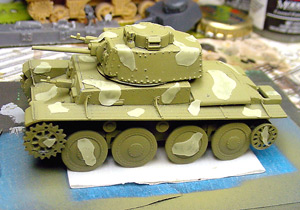 [I then cut small random shapes out of tape and placed them on the model.]