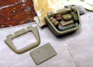 [I cut out a hatch on one of the rear storage boxes and filled it with some Presser bags, rolls, and other equipment items.]