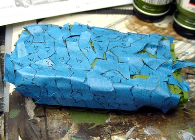 [To get the splinter camouflage scheme, I cut blue masking tape on a mirror, and then placed all of the pieces on the tank.]