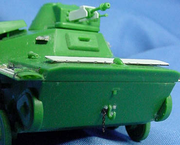 [The splash deflector and the main gun guard were too thick, and were replaced with sheet styrene parts, and both gun barrels, were drilled out. Also note the front hook with bolts and chain, and the hefty seam that had to be filled.]