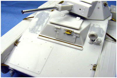 [The driver's front hatch was detailed with a piece of brass filed and bent to shape, and six rivets in two different sizes.]