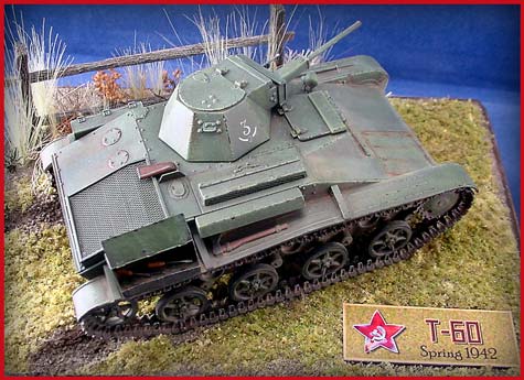 [A pigment wash was then applied to the lower hull and running gear, and after drying, the excess was removed, leaving some in the cracks and corners. ]